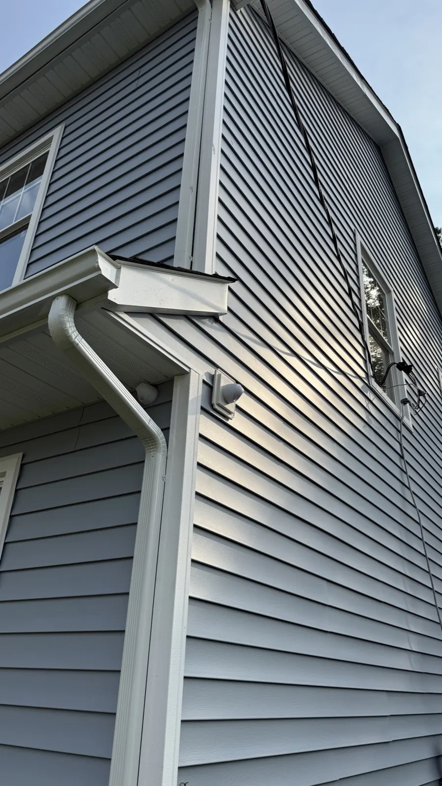 Security camera mounted under the eave of a New Jersey home