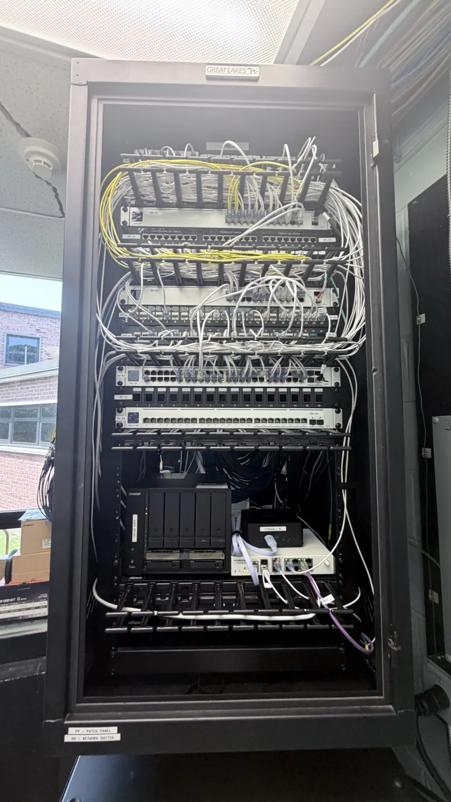 Office network rack with switches — installed by TrekTek