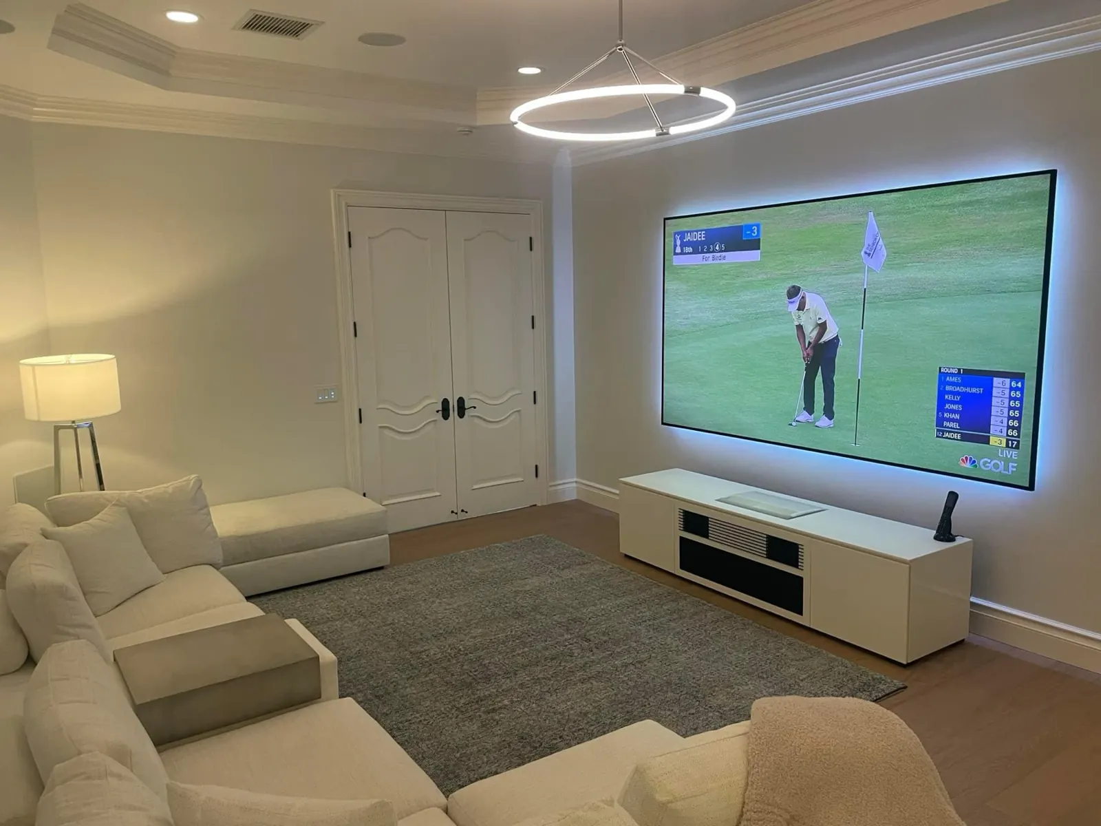 Finished living room with projection screen installed by TrekTek