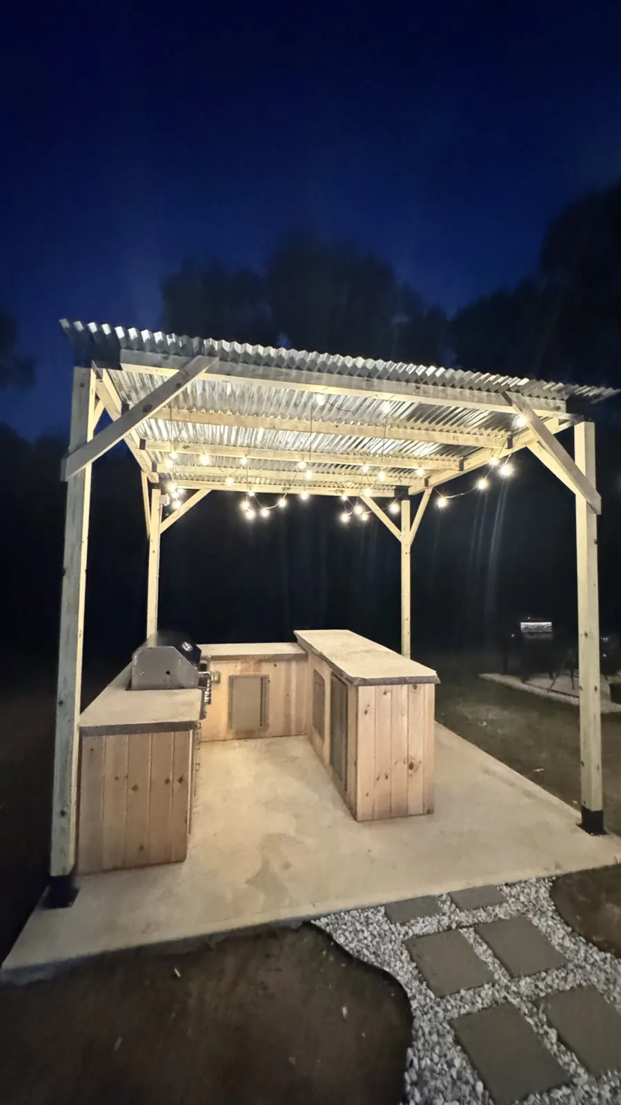 Outdoor living, lit — installed by TrekTek