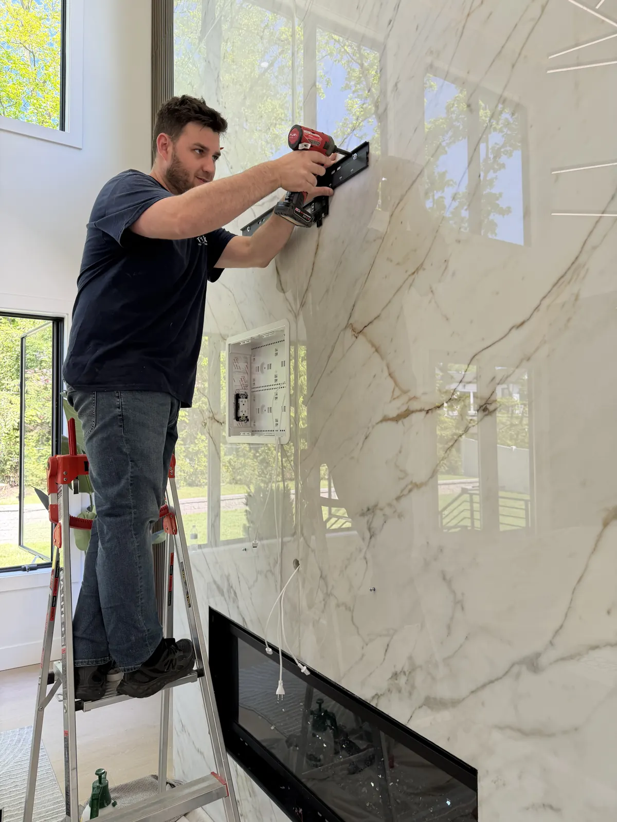 Paul mounting a media wall — Somerset County — TrekTek Technologies