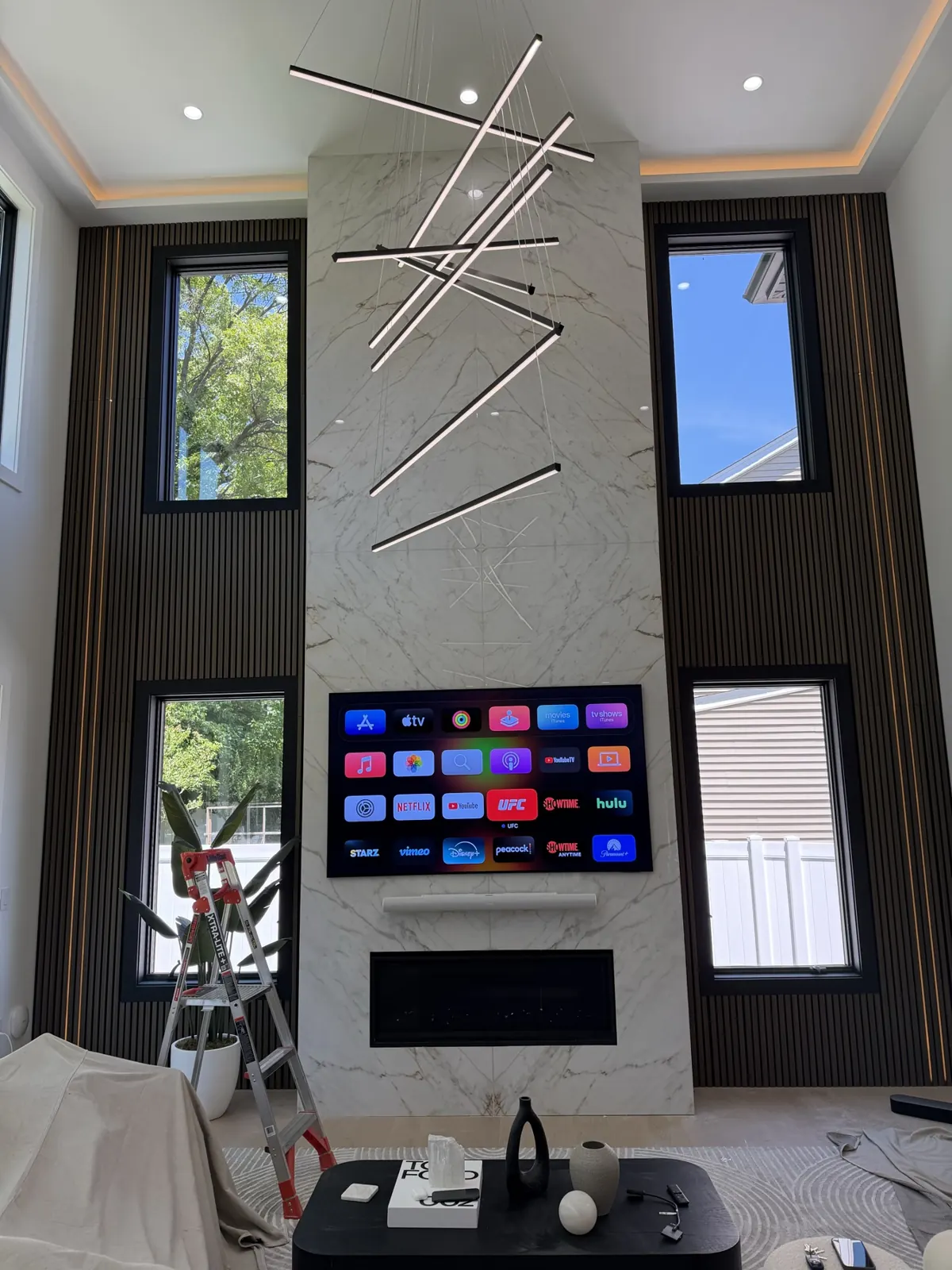 Marble fireplace TV wall installed by TrekTek